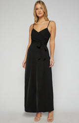 Woman wearing a black dress on a white background